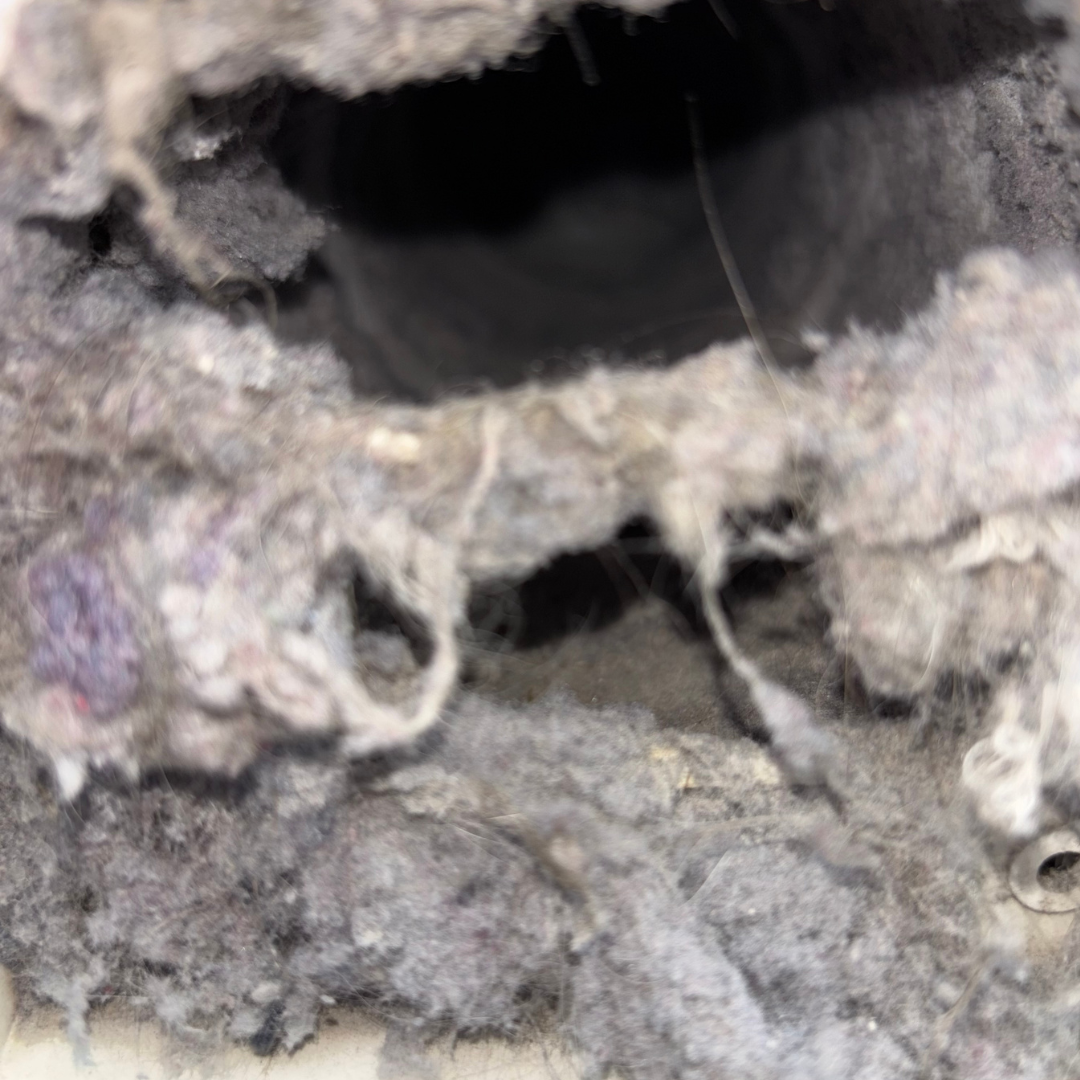 Before duct cleaning - matted dust and debris inside a ductwork system